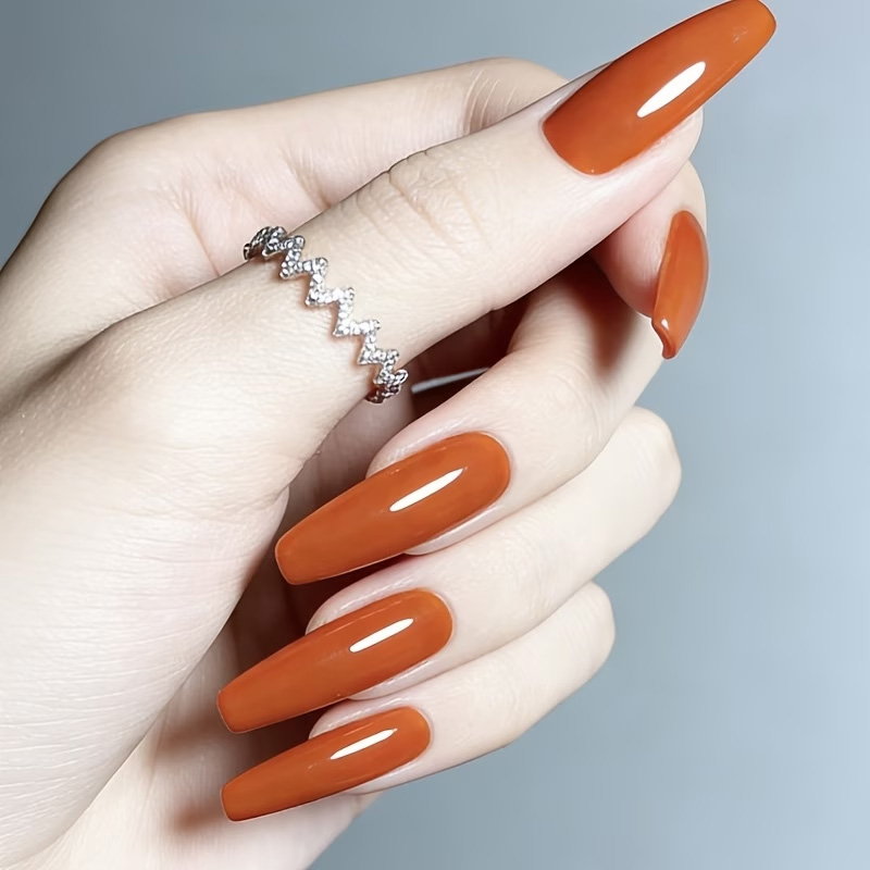 زيت تقوية الأظافر بلون الكرامي - مراجعة Nail Art Orange وسعره